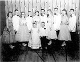 Class 0f 1959 Junior Prom.  L-R: Grace Zimmerman, Dennis Feller, Anna Marie Marty, John Ponyiscanyi, Carolyn Klassy, Walter Mueller, Mary Klassy, John Holdrich, Judith Gibbons, Thomas Marty.  The little king is Jim Stenbroten and the little queen is Cindy Klassy.